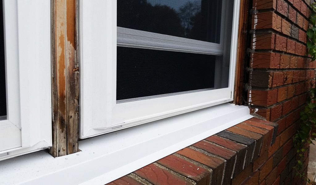 New window installation with PVC trim covering